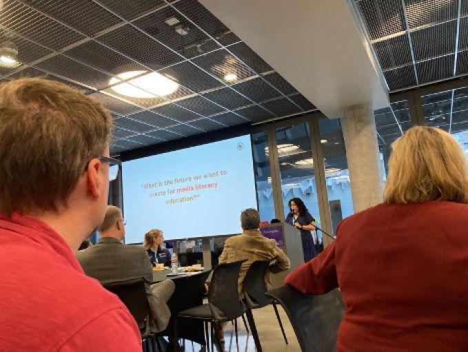 photo taken from perspective of audience member of a slide presentation.