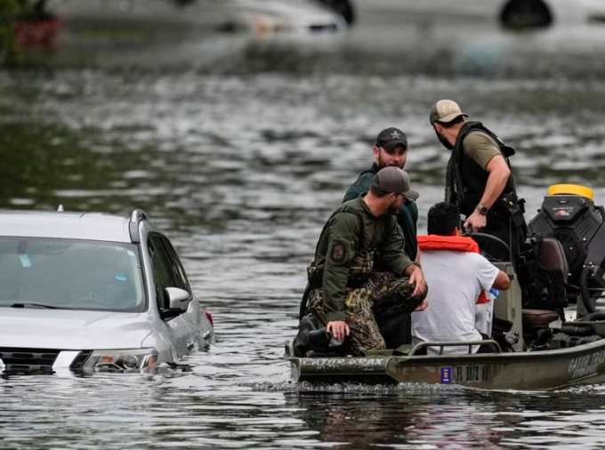 Rescuers evacuate people from a flooded apartment complex in Clearwater, Florida, on Oct. 10, 2024, after Hurricane Milton hit.