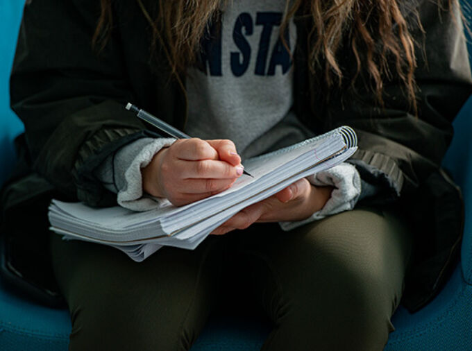 writing in notebook