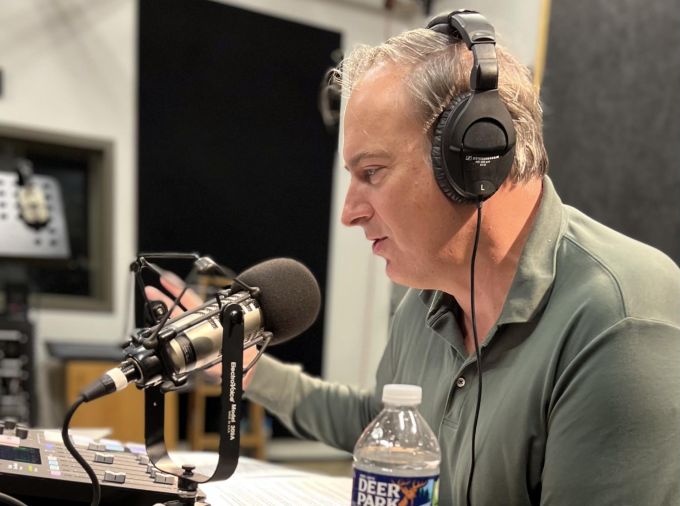 Matt Jordan recording podcast in studio.